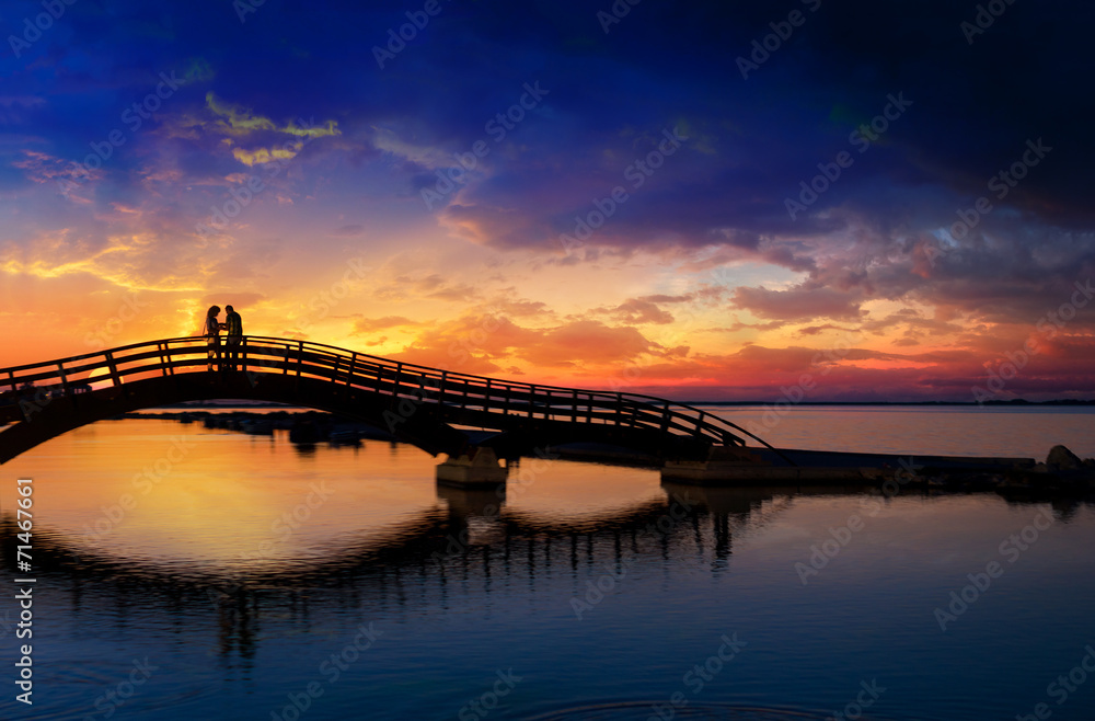 Couple enjoying the romantic sunset on the Lefkas town bridge