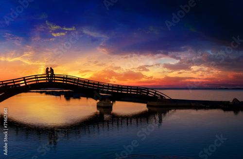Couple enjoying the romantic sunset on the Lefkas town bridge © Netfalls