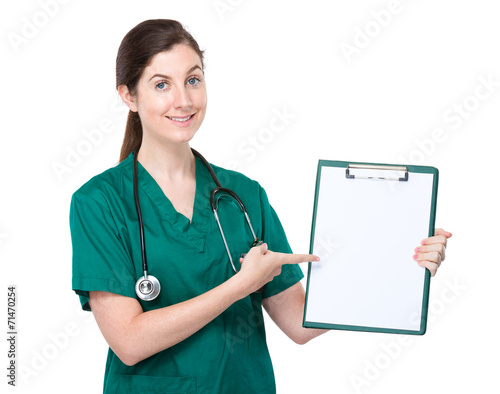 Doctor finegr point to balnk page of clipboard