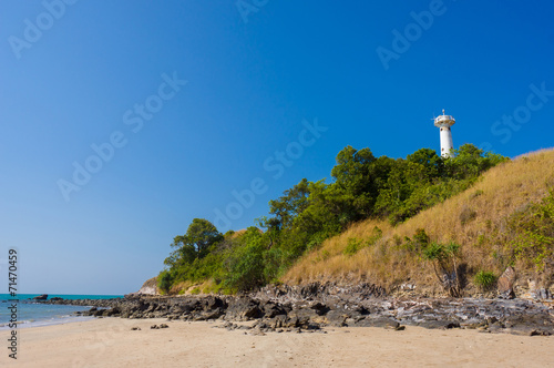 Old lighthouse and white sand beach on Koh Lanta Yai island cape