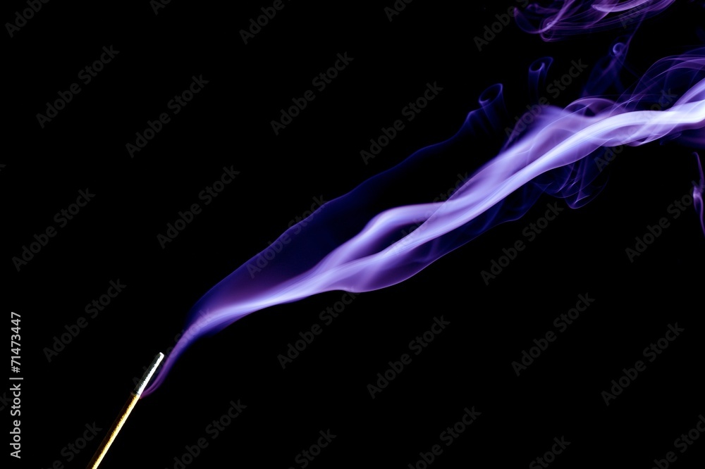 Incense stick with smoke on black background Incense stick with smoke on black background