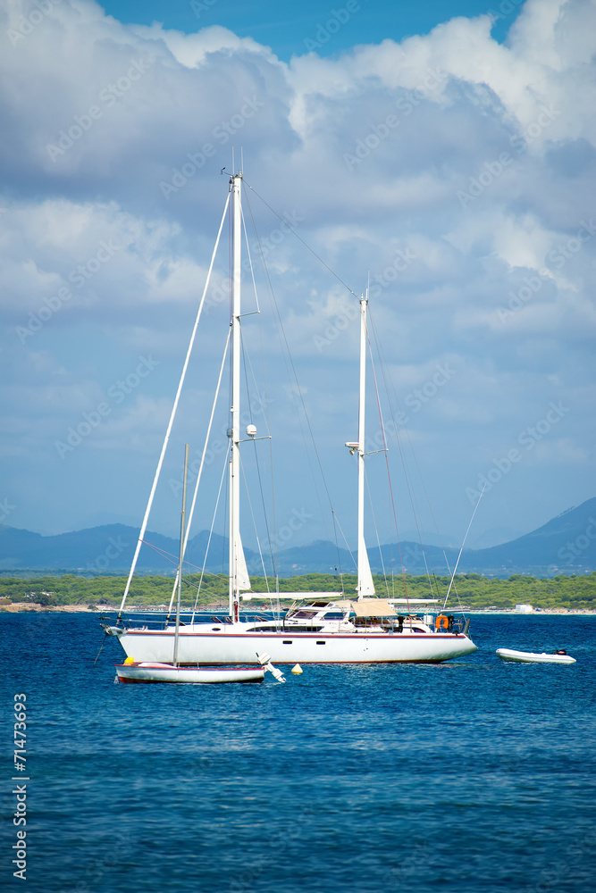 Yacht in the bay at anchor. Yacht in the bay at anchor.