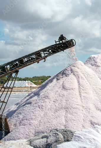 Sea salt production. The conveyor belt with salt.