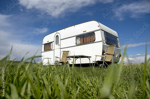 caravan camping with table and two chars Fototapet