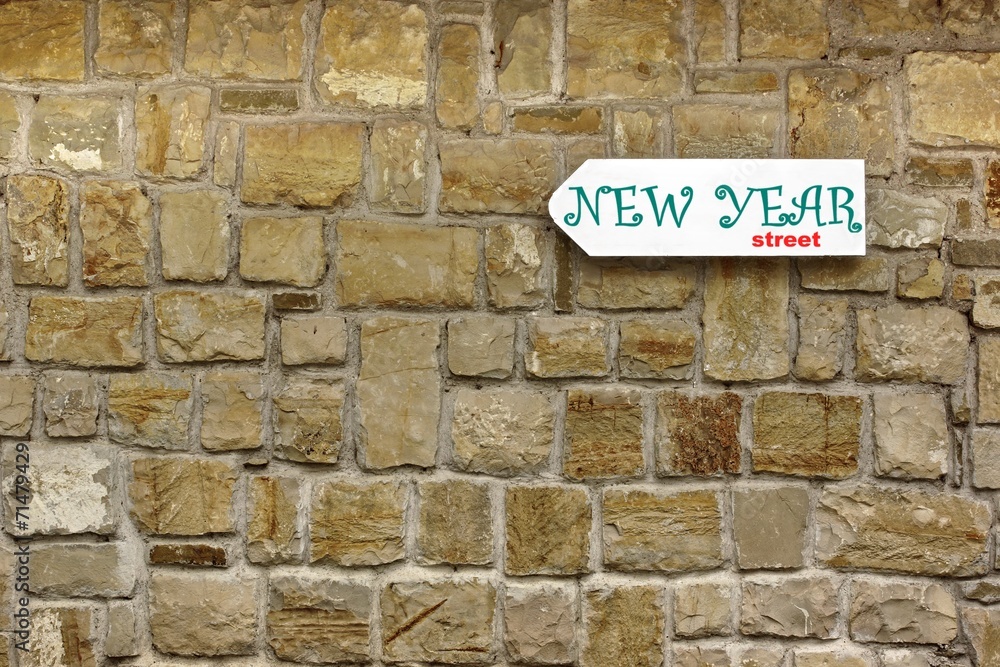 Direction Signboard on the old stone wall Direction Signboard on the old stone wall