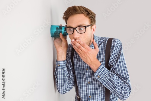 фотографія Geeky businessman eavesdropping with cup