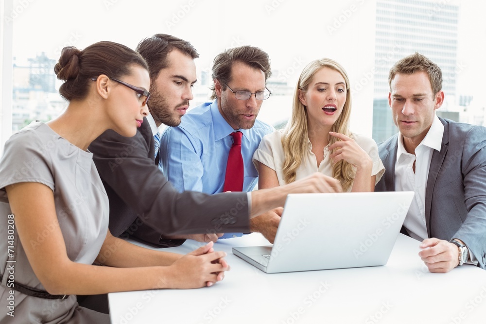 Business people using laptop in office Business people using laptop in office
