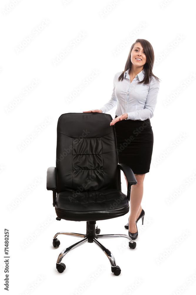 Businesswoman inviting to sit on an office chair - isolated Businesswoman inviting to sit on an office chair - isolated