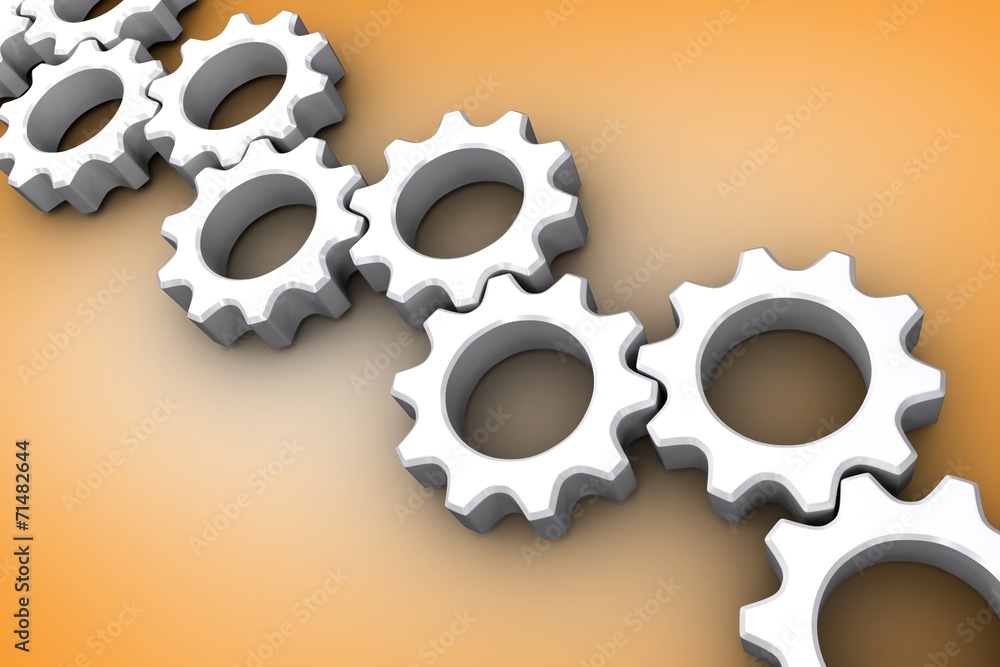 Composite image of many white cogs and wheels Composite image of many white cogs and wheels