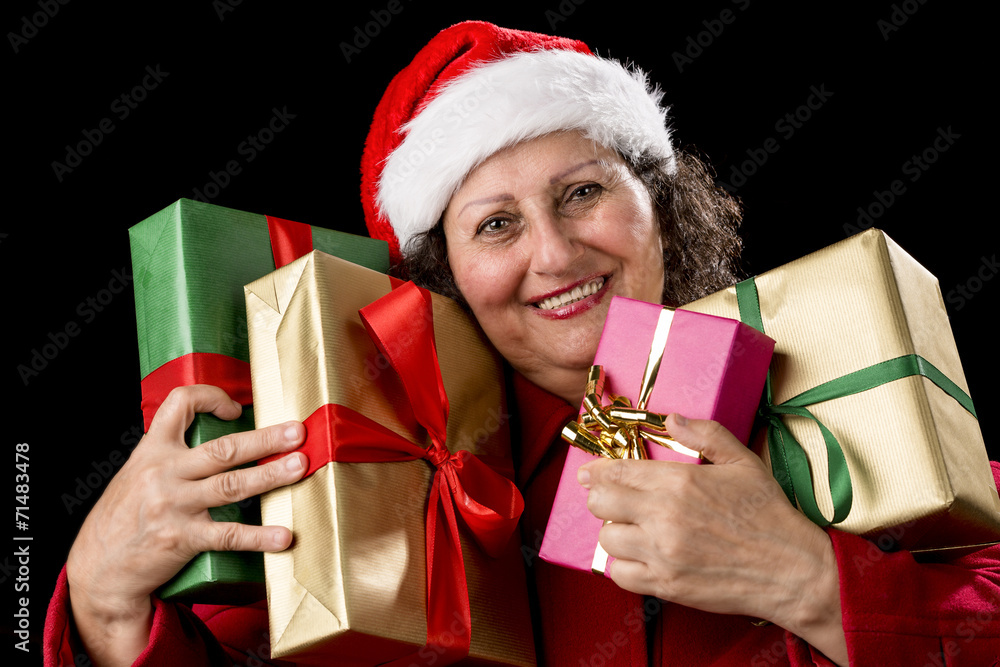 Smiling Aged Woman Embracing Four Wrapped Gifts. Smiling Aged Woman Embracing Four Wrapped Gifts.
