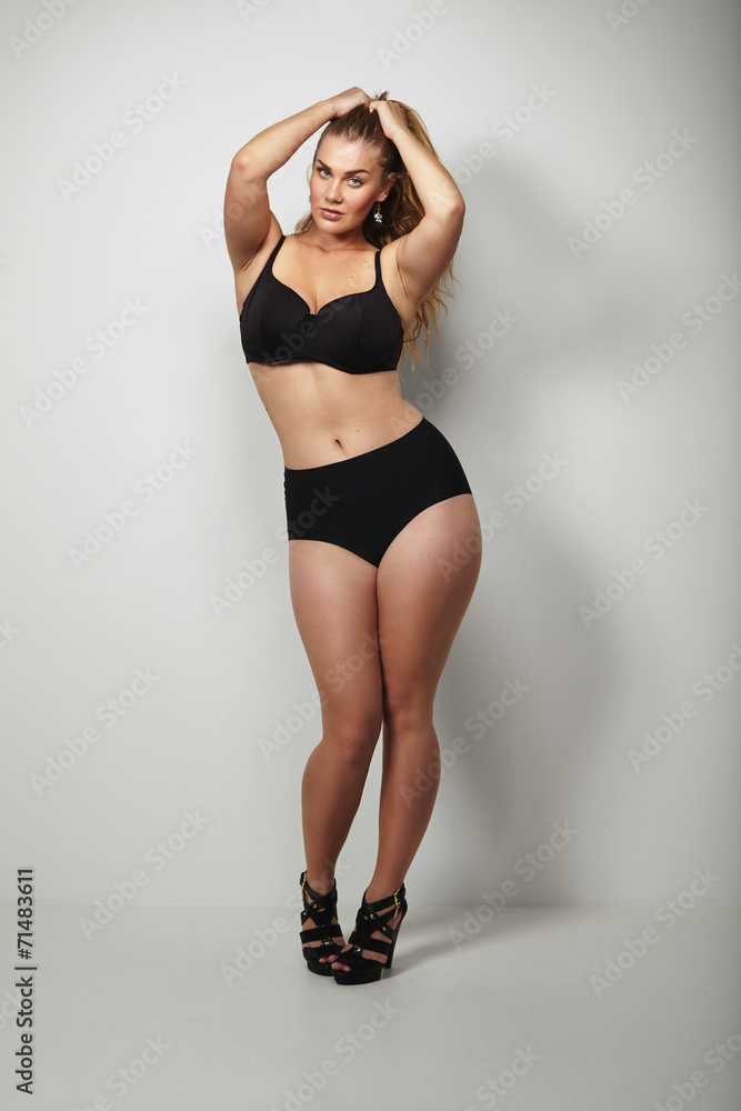 Foto de Plus size female model in underwear with beautiful curves do Stock