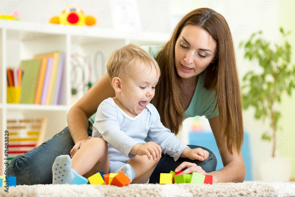 cute mother and kid boy playing together indoor cute mother and kid boy playing together indoor