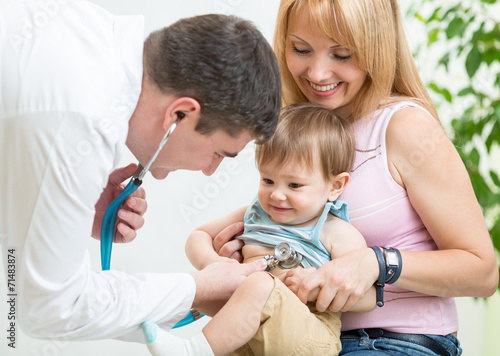 doctor examining kid patient with stethoscope