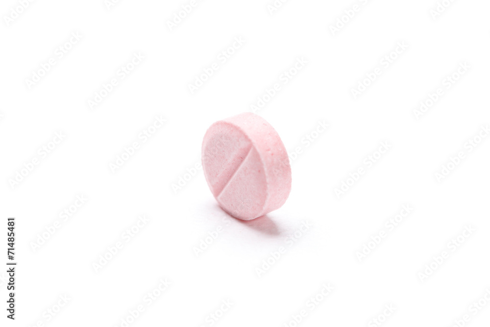 Pink tablet, isolated on white. Healthcare concept Pink tablet, isolated on white. Healthcare concept
