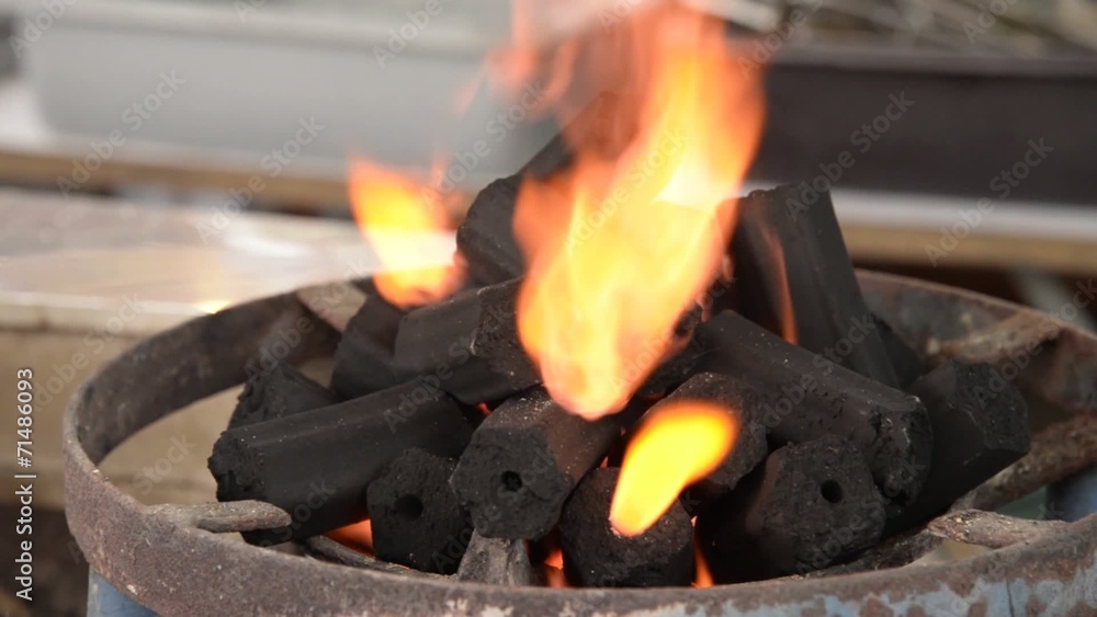 Charcoal with flame burning closeup Charcoal with flame burning closeup