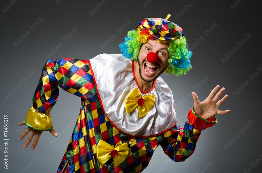 Funny clown in colourful costume Funny clown in colourful costume