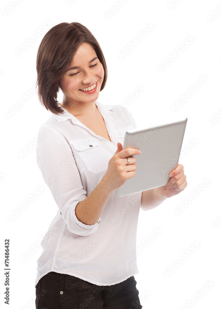 Smiling woman reading on an electronic tablet Smiling woman reading on an electronic tablet