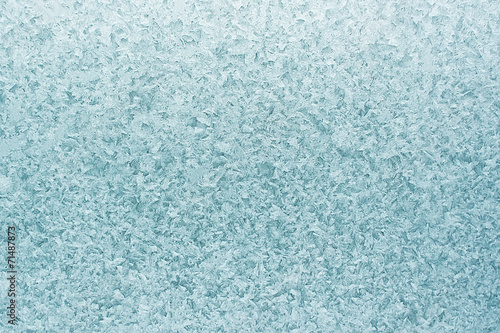 Patterns on glass in the frosty winter day. Christmas background