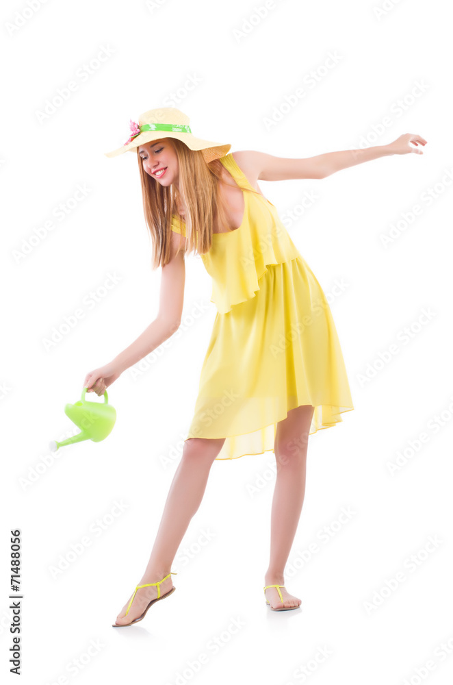 Woman in yellow dress with watering can - obrazy, fototapety, plakaty 