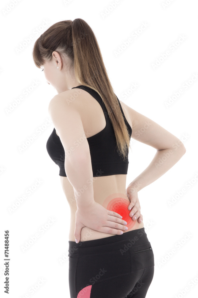 sporty girl in sportswear with pain in her back isolated on whit