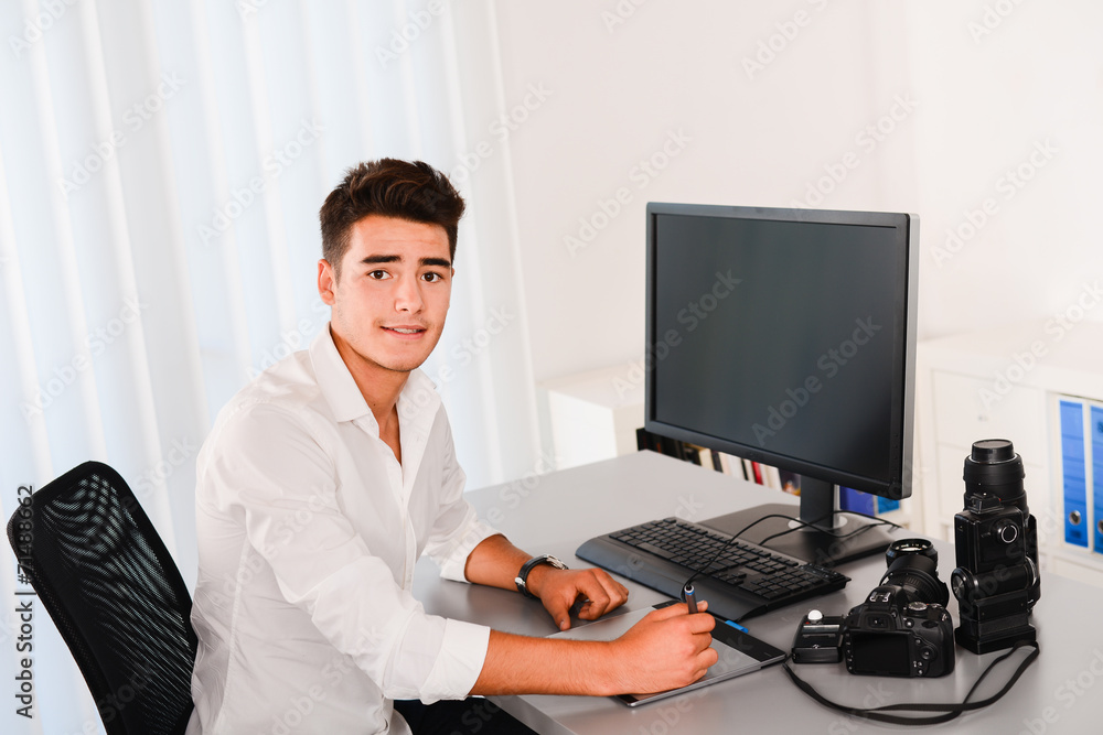 handsome young man editing photography