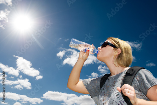 Blonde woman drinking water