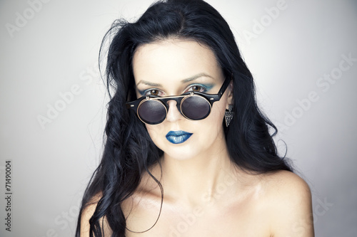 Wallpaper Mural Beautiful young woman in sunglasses on gray background Torontodigital.ca