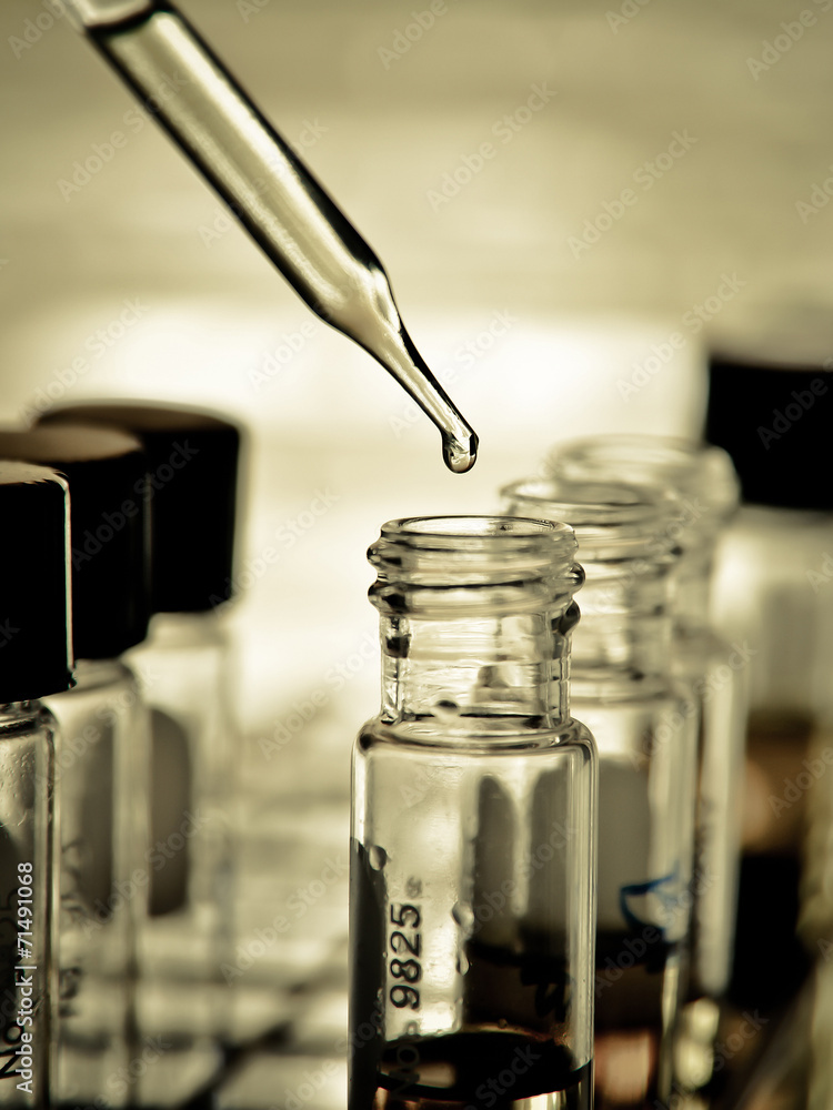 Laboratory research, dropping liquid to test tube Laboratory research, dropping liquid to test tube