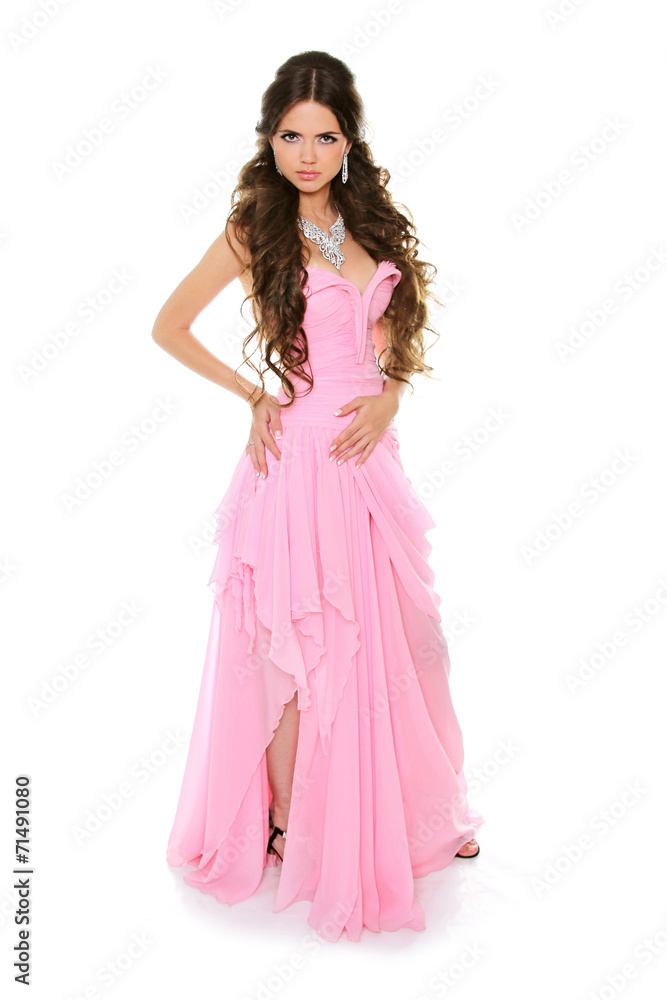 Beautiful brunette girl wearing in pink dress isolated on white