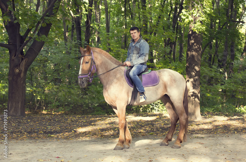 horse ride young guy autumn forest © lester120