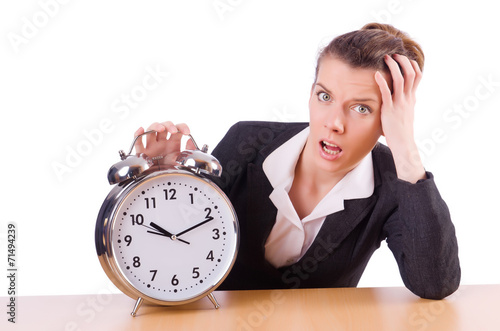 Businesswoman with clock missing her deadlines