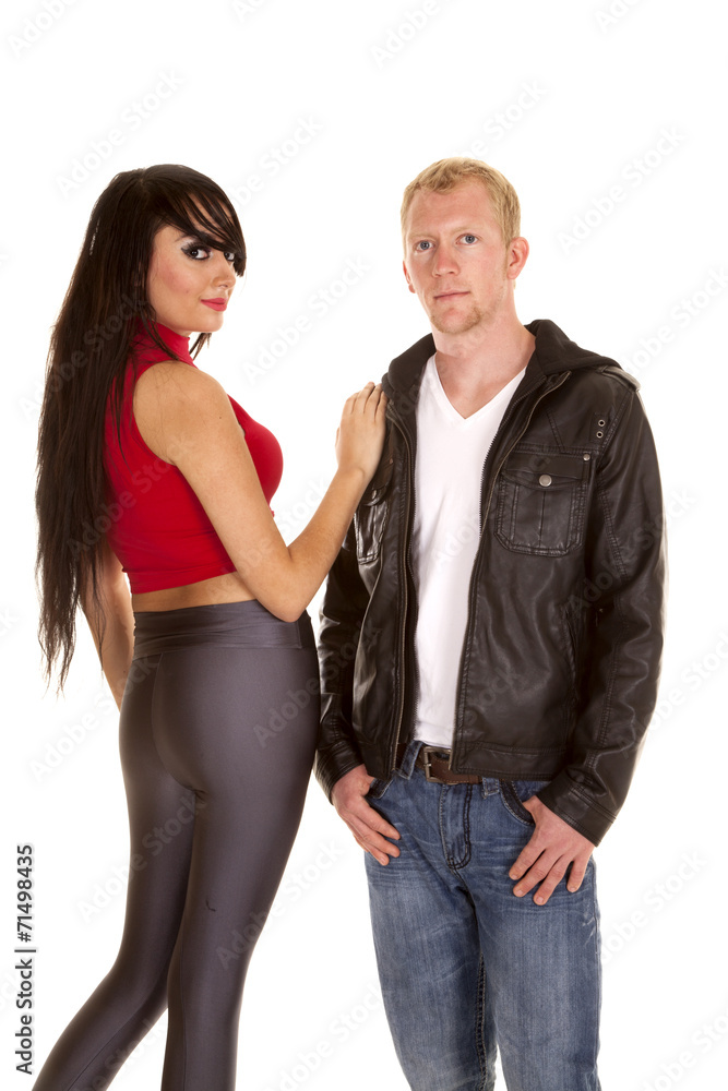 man in black jacket front woman gray pants back both looking man in black jacket front woman gray pants back both looking