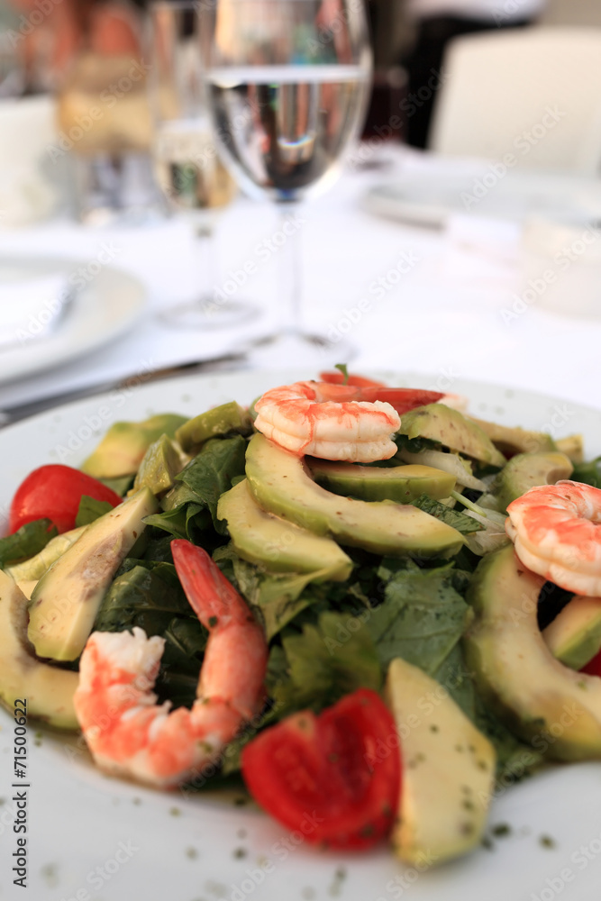 Plate with seafood and avocado salad Plate with seafood and avocado salad