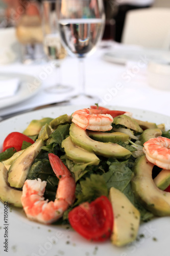 Plate with seafood and avocado salad