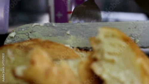 Close up of Fork and Knife Cutting Bread - Outdoor Cooking