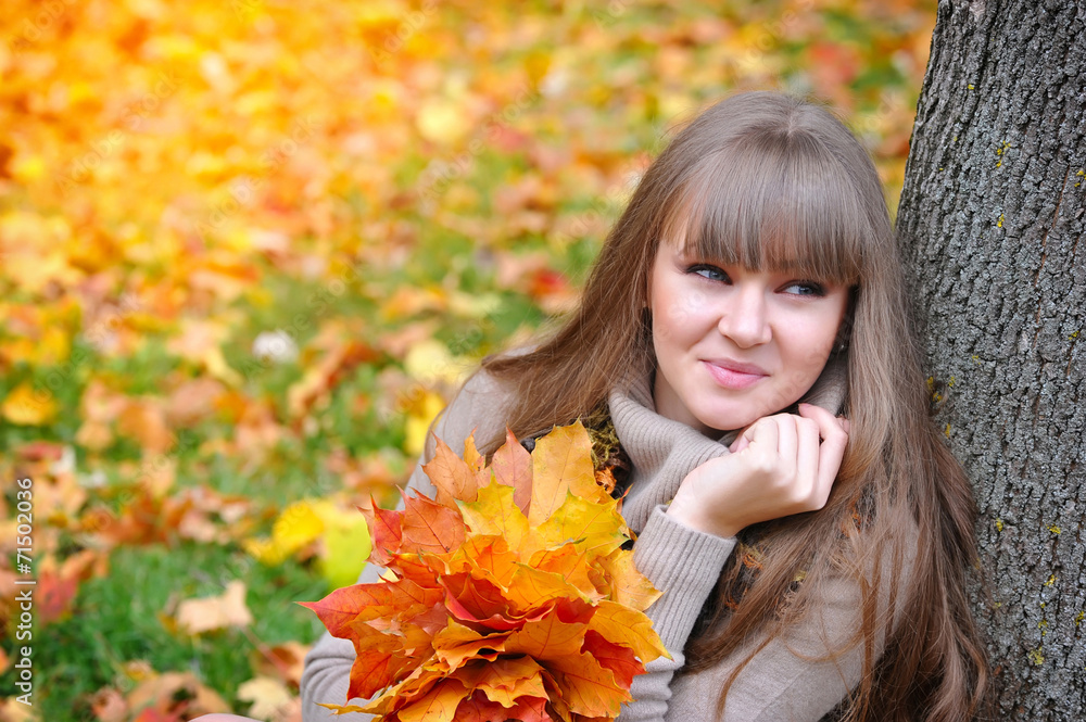 Portrait of beautiful young woman with autumn leaves Portrait of beautiful young woman with autumn leaves