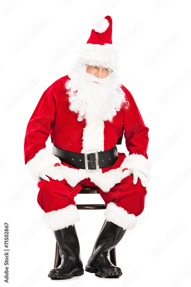 Worried Santa Claus sitting on a chair Worried Santa Claus sitting on a chair