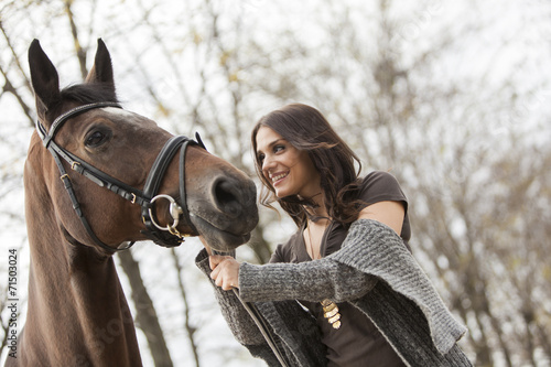Young girl with a horse