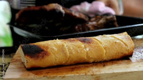 Steak and Garlic Bread on a Chopping Board - Outdoor Cooking