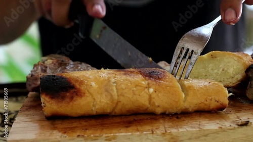 Fire Cooked Garlic Bread Roll on the Chopping Block