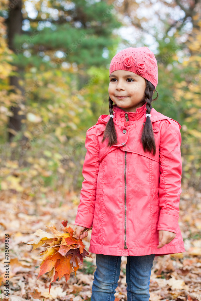 Little pretty girl with autumn leaves in an autumn park Little pretty girl with autumn leaves in an autumn park