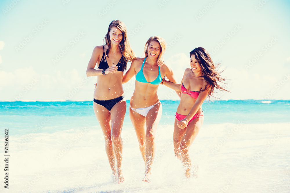 Beautiful Happy Girls on the Beach