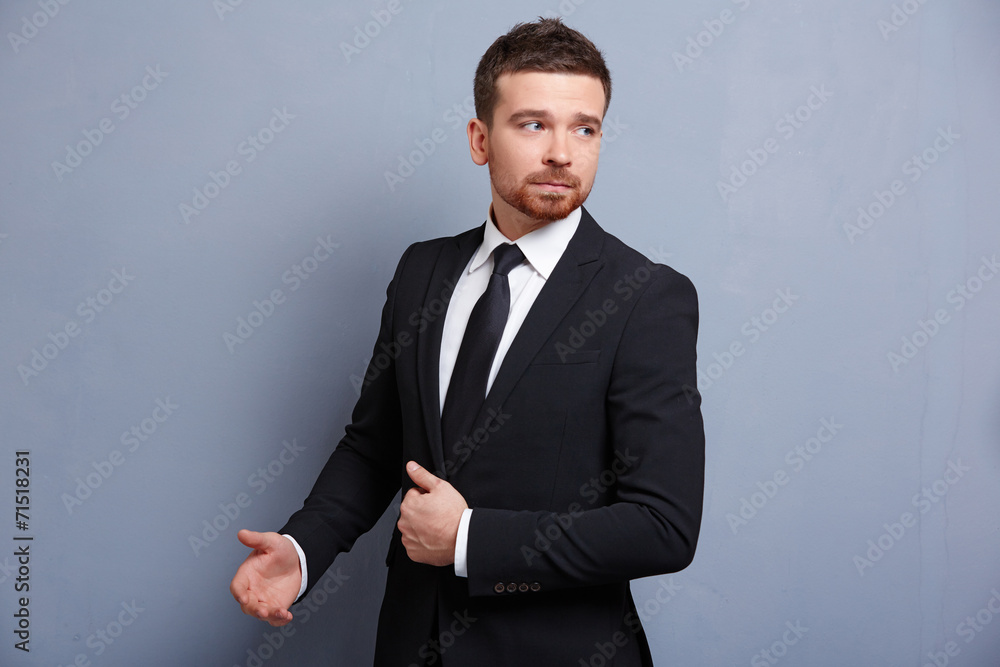 man adjusts his suit clothes man adjusts his suit clothes