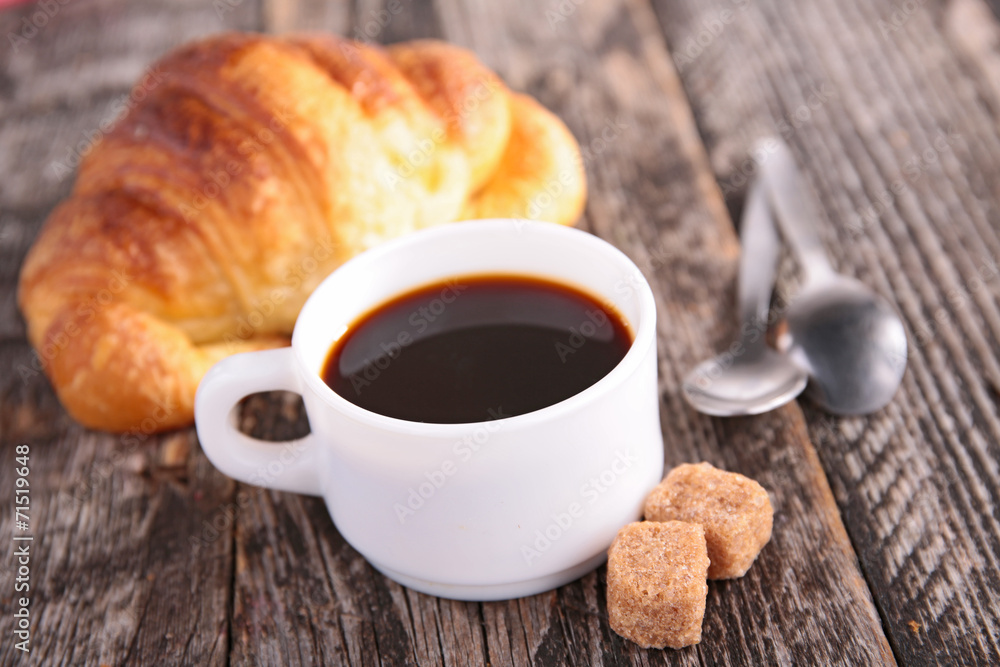 coffee cup and croissant coffee cup and croissant