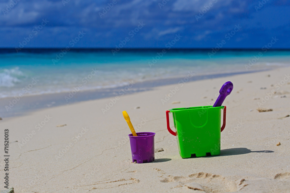 kids toys on tropical sand beach kids toys on tropical sand beach