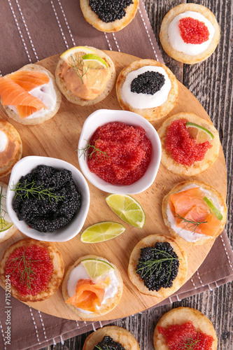 canape with caviar, salmon and cheese