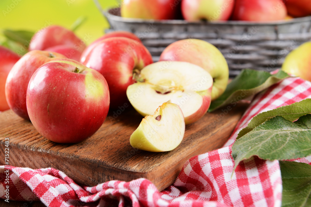 Sweet apples  on table on bright background