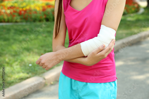 Sports injuries of girl outdoors