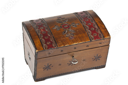 old scratched wooden casket with an ornament on a white backgrou