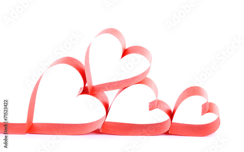 Heart shaped red paper ribbon isolated on white photo